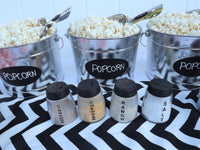 silver metal popcorn buckets with popcorn scoops