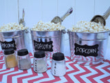 metal popcorn buckets with chalkboard labels